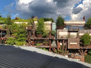 a building with plants on the side of it at CASA MAROCHETTI in Turin