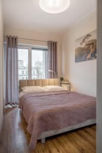 Posteľ alebo postele v izbe v ubytovaní Apartament G11 z miejscem parkingowym