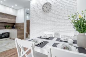 Kuchyňa alebo kuchynka v ubytovaní Apartament G11 z miejscem parkingowym + 2 fotografie