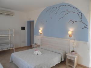 Postel nebo postele na pokoji v ubytování Hotel Tabby