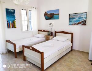 A bed or beds in a room at Nesaea Studio