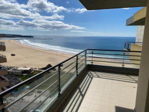 a balcony with a view of the beach at Casa da Praia 901 in Portimão