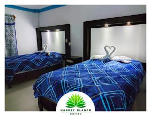 Postel nebo postele na pokoji v ubytování Hotel Maguey blanco