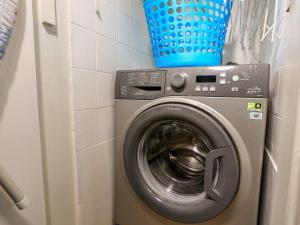 a washing machine with a blue basket on top of it at 3 Dartview in Dartmouth