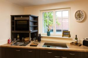 Kuchyň nebo kuchyňský kout v ubytování Ferienwohnung Schwalbennest-Großkoschen