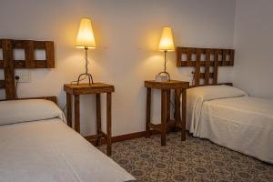 A bed or beds in a room at La Vaquería