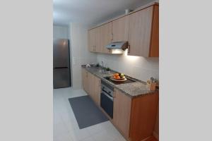 Virtuvė arba virtuvėlė apgyvendinimo įstaigoje Apartamento moderno Timanfaya