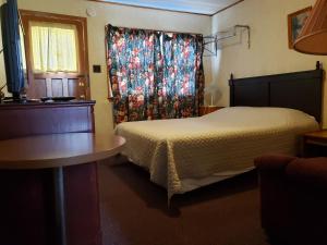 Postel nebo postele na pokoji v ubytování Regent Motel