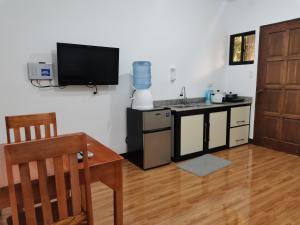 a kitchen with a sink and a counter top at AFS Suites Barra, Opol in Cagayan de Oro