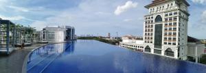 a swimming pool on the roof of a building at FREE NETFLIX! ZAs Suite at Troika Residence, KB in Kota Bharu