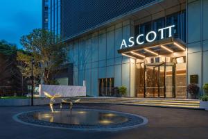 a building with a fountain in front of it at Ascott ICC Guangzhou-Free shuttle bus for canton fair in Guangzhou