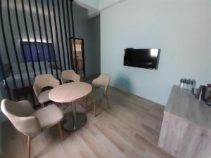 TV a/nebo společenská místnost v ubytování Yueli Homestay