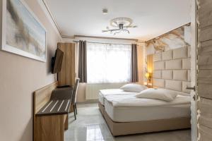Ліжко або ліжка в номері Hotel Restaurant Meteora