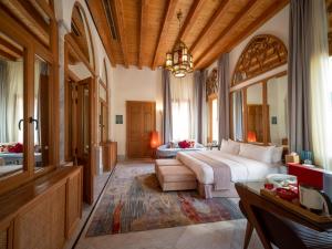 a large bedroom with a large bed and a couch at Arthaus Beirut in Beirut