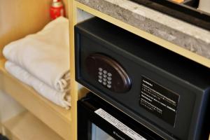 Un pat sau paturi într-o cameră la Hotel Midcity Myeongdong