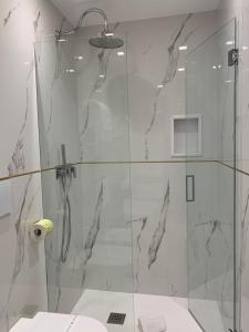 a bathroom with a shower with a glass door at B&B Rocca del Civitillo in Notaresco