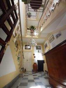 a hallway of a building with a checkered floor at Villa Viola in Tortona