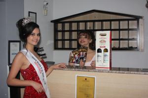 two women standing next to each other in a kitchen at Hotel Albatros in Prizren