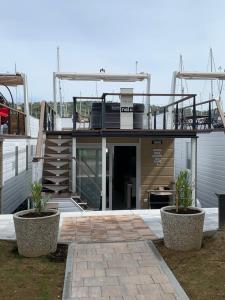 a house with a balcony on top of it at Nalu Seahouse in Portorož