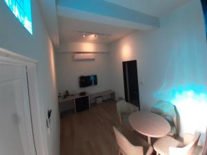 TV a/nebo společenská místnost v ubytování Yueli Homestay