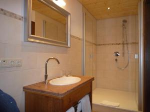 a bathroom with a sink and a shower at Gästehaus Johanna in Bad Wiessee +77 photos