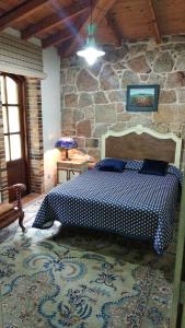 Tempat tidur dalam kamar di Casa Ramoniña