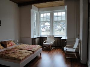 En eller flere senge i et værelse på Villa Cella