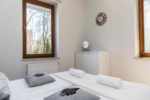 Posteľ alebo postele v izbe v ubytovaní udanypobyt Apartament z Basenem