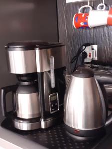 a coffee pot sitting on top of a coffeemaker at RESIDENCE NUEVO HORIZONTE in Costa de Antigua