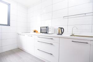 Kuchyň nebo kuchyňský kout v ubytování 亞窩行館 Yao Guesthouse + 8 fotografií