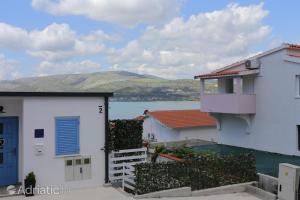 a view of the water from the balcony of a house at Apartments Bagaric in Trogir
