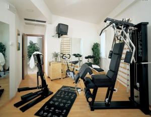 a gym with exercise equipment in a room at Hotel Esperia in Cattolica