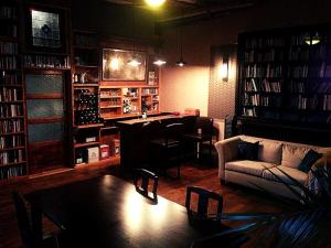 a living room with a couch and a table at Gite Esmeralda in Biert