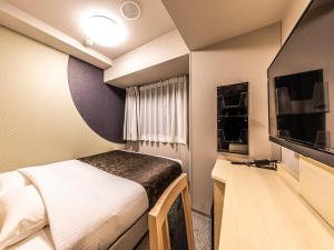 TV o dispositivi per l'intrattenimento presso APA Hotel Shin Osaka Eki Tower