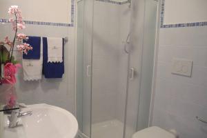 a bathroom with a shower and a sink and a toilet at Sea&sky in Praiano
