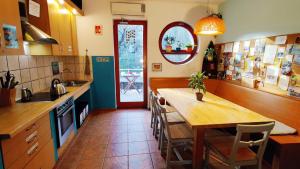 a kitchen with a table and a dining room at Shantee House in Budapest