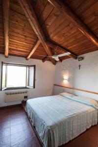 Postel nebo postele na pokoji v ubytování VILLA CON MAGNIFICO TERRAZZO IUN P6868