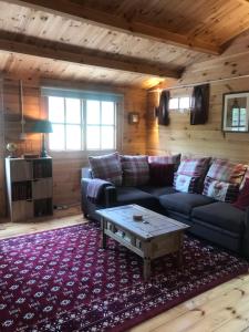 a living room with a couch and a coffee table at The Cabin in Chester