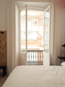 Posteľ alebo postele v izbe v ubytovaní Planeta Cadiz Hostel