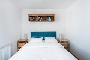 Posteľ alebo postele v izbe v ubytovaní Apartament Niebieski OPTILOCUS
