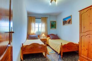 Postel nebo postele na pokoji v ubytování Villa Morera