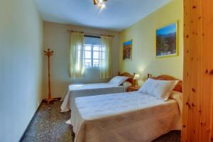 Postel nebo postele na pokoji v ubytování Villa Morera