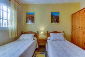 Postel nebo postele na pokoji v ubytování Villa Morera