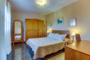 Postel nebo postele na pokoji v ubytování Villa Morera