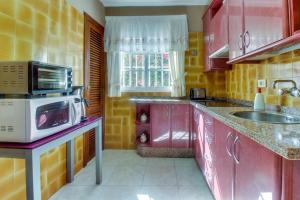 Kuchyň nebo kuchyňský kout v ubytování Villa Morera