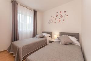 Posteľ alebo postele v izbe v ubytovaní Villa Sali ZadarVillas