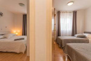 Posteľ alebo postele v izbe v ubytovaní Villa Sali ZadarVillas