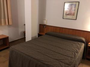 Llit o llits en una habitació de Hotel Refugi dels Isards