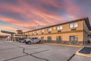 a truck parked in a parking lot in front of a building at Comfort Inn Near Kokomo Speedway in Kokomo