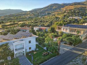 an aerial view of a house with solar panels at Παντέλειο in Karistos